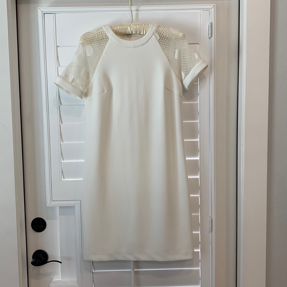 Badgley Mischka cream color dress with lace detail on sleeves